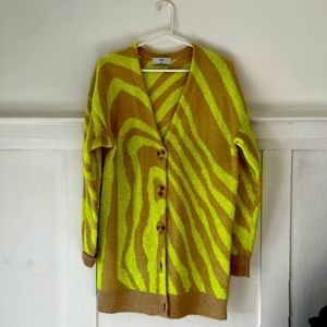 TNA slightly oversized knit sweater. definitely a neon yellow with neutral.